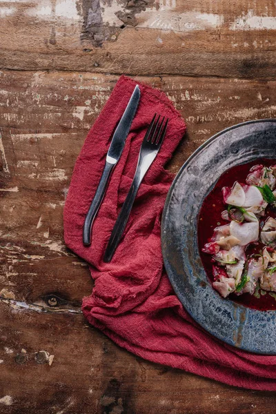 Top view of fresh tasty Ceviche with dorado and daikon on wooden table — Stock Photo