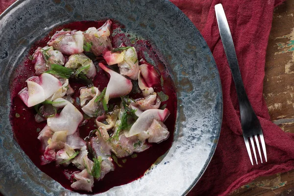 Top view of Ceviche with dorado and daikon on wooden table — Stock Photo