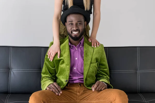 Cropped shot of woman touching smiling african american boyfriend isolated on grey — Stock Photo