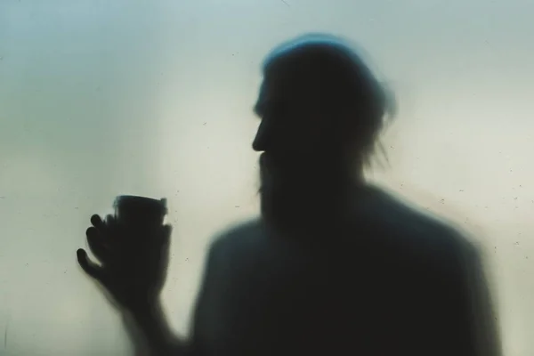 Man behind frosted glass — Stock Photo