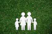 paper cut of family on grass