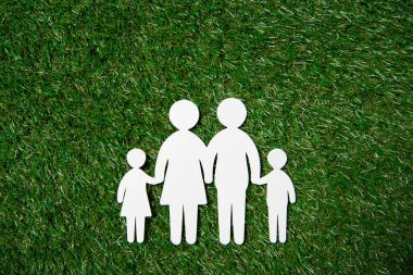 paper cut of family on grass clipart