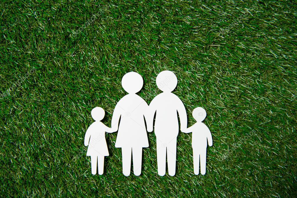 paper cut of family on grass