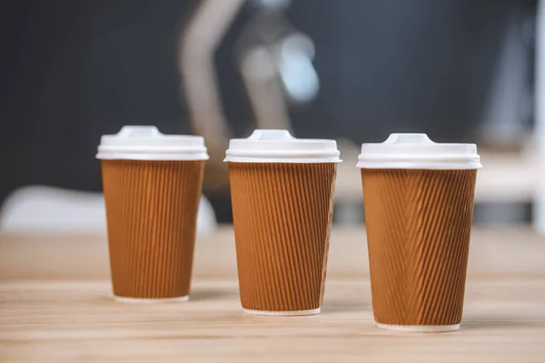 Disposable cups of coffee — Stock Photo, Image