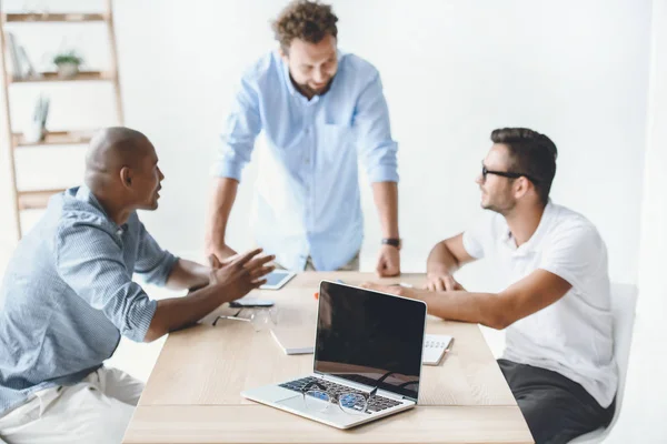 Multiethnic businessmen on meeting — Stock Photo, Image