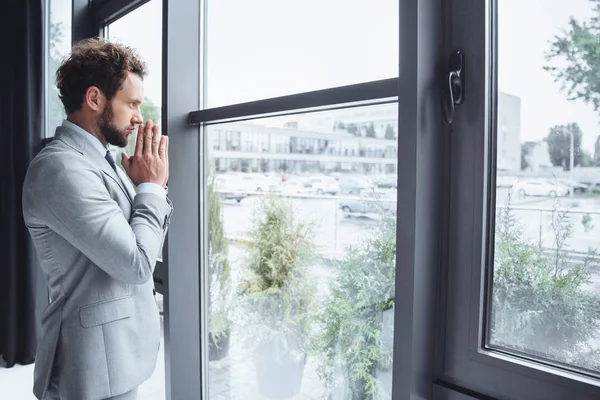 Caucasian businessman praying — Stock Photo, Image