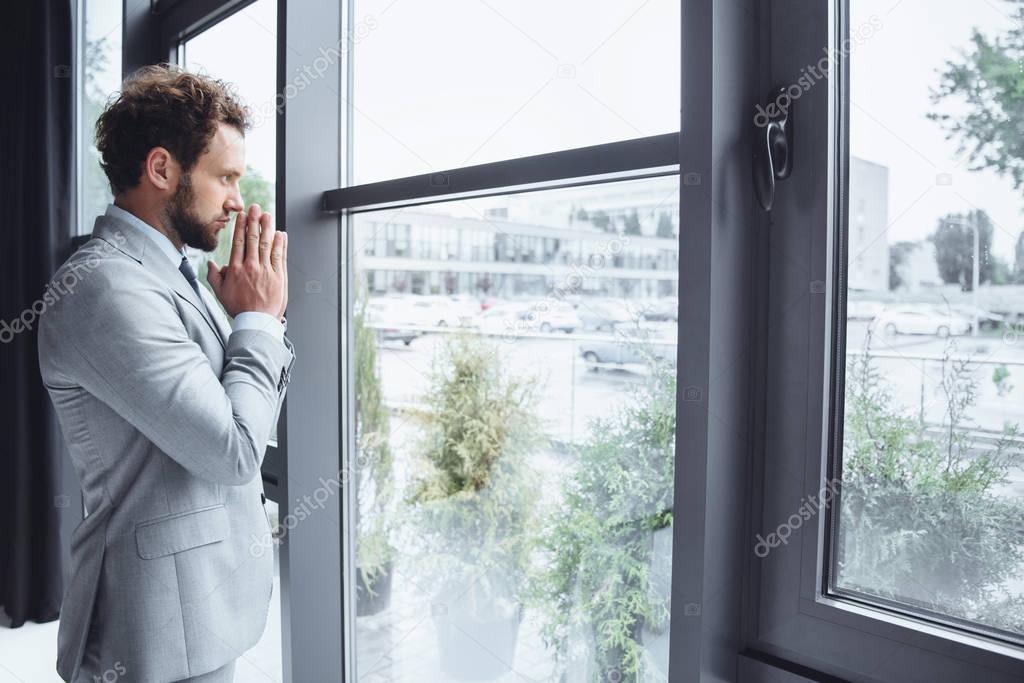 caucasian businessman praying