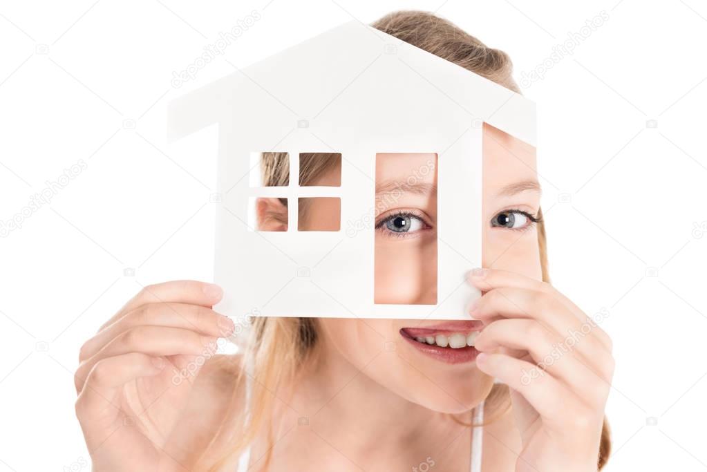 kid with house model