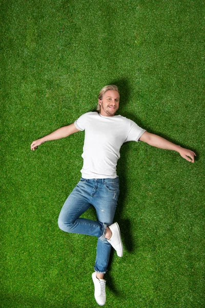 Young man relaxing on meadow — Stock Photo