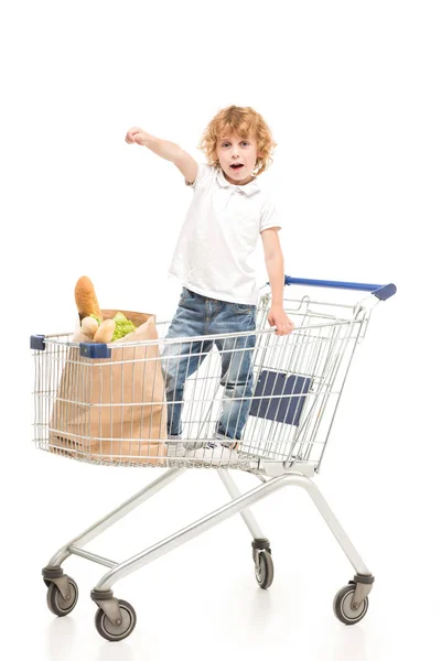Kid in shopping cart — Stock Photo