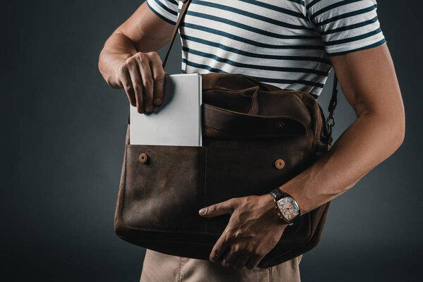 Stylish man with leather bag 