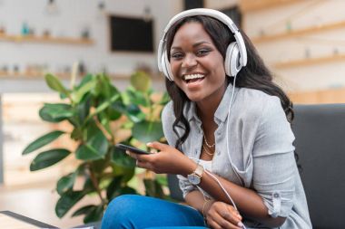 woman listening music with headphones 