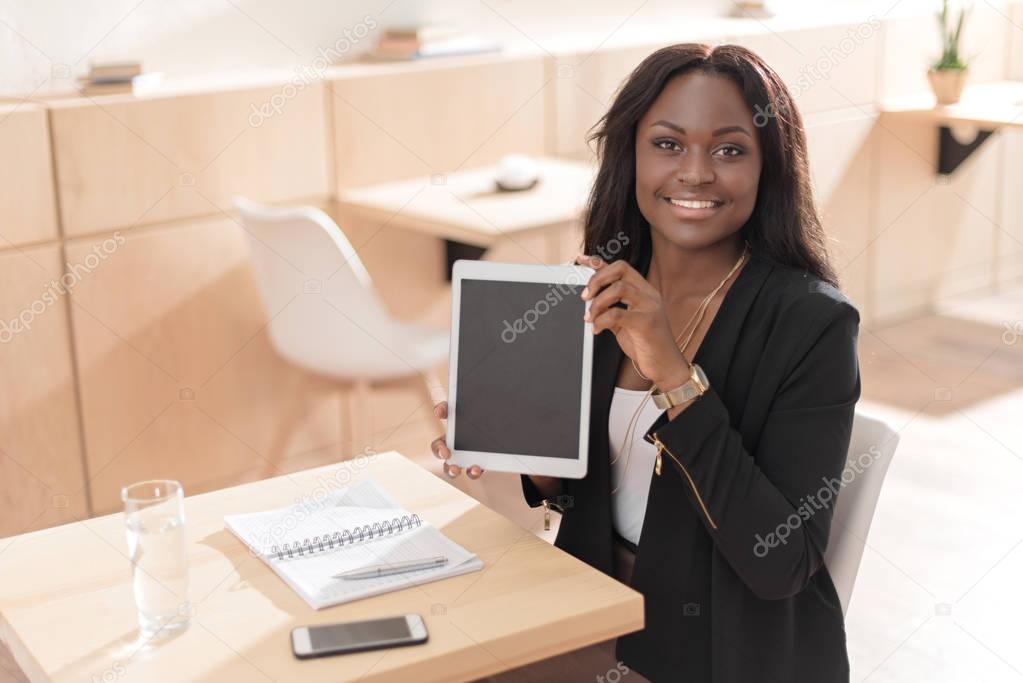 woman presenting digital tablet 