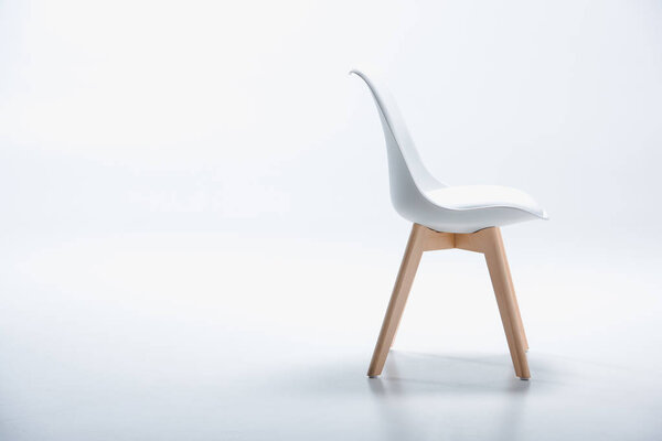 chair with white top and wooden legs