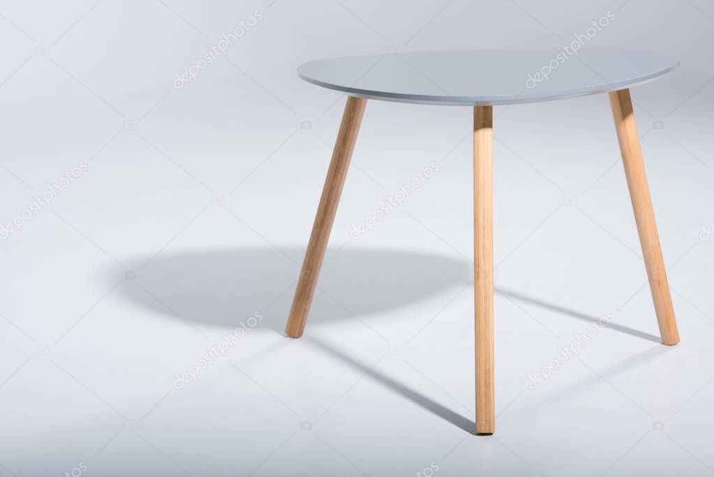 stool with white top and wooden legs