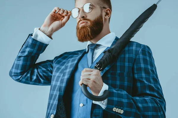 Attractive man in suit with umbrella — Stock Photo, Image