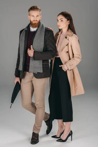 Fashionable couple with umbrella — Stock Photo, Image