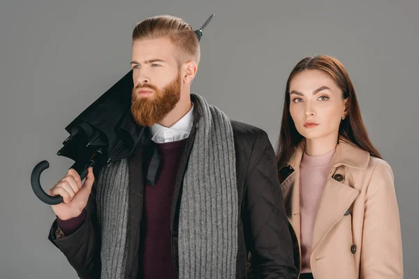 Fashionable couple with umbrella — Stock Photo, Image