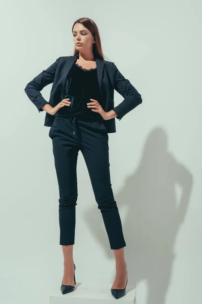 Girl posing in suit — Stock Photo, Image