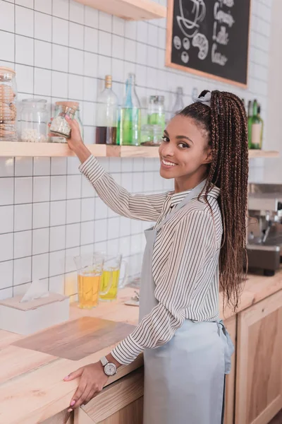 Barista taking glass jar with marshmallows — Stock Photo, Image