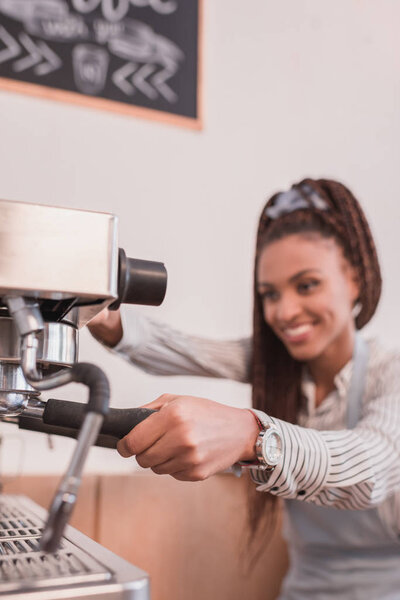 barista making coffee with machine