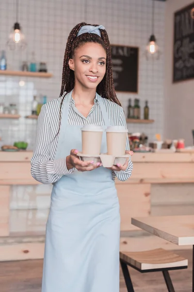 Barista holding holder with disposable cups — Stock Photo, Image