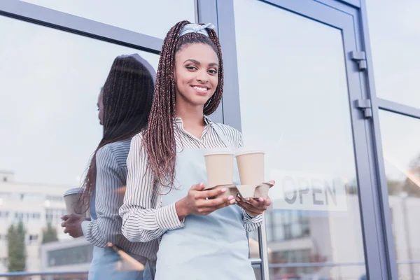 Barista holding two paper cups — Stock Photo, Image