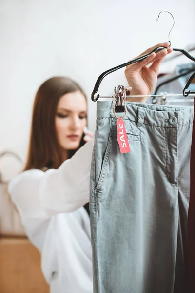 Choosing clothes for sale — Stock Photo, Image
