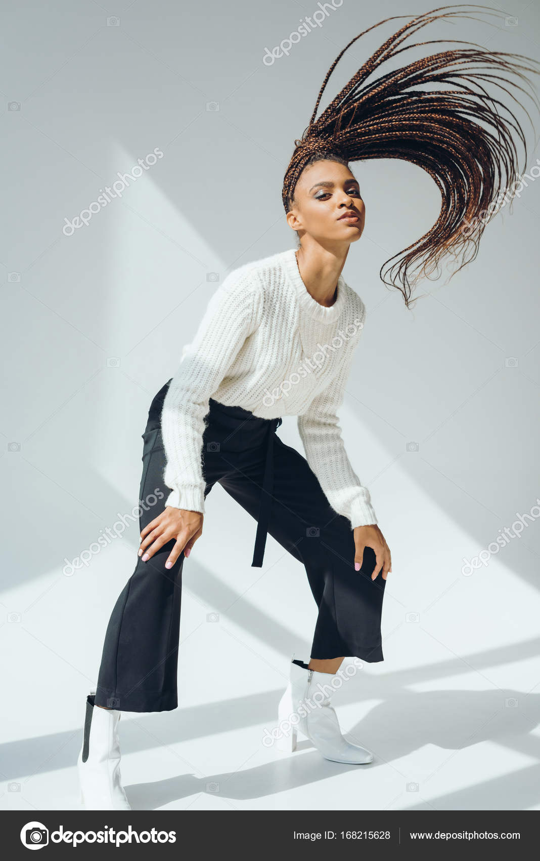 Girl in knitted sweater and pants Stock Photo by ©VitalikRadko 168215628