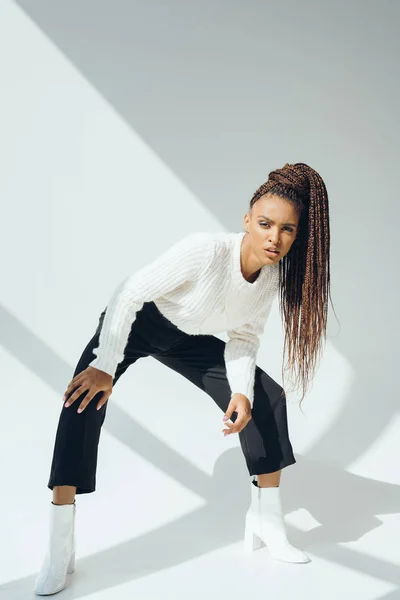 African american girl in white sweater — Stock Photo, Image