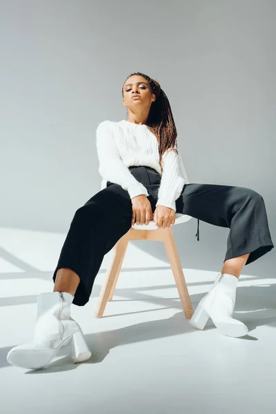 stock image fashionable african american girl on chair