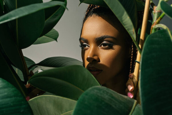 african american girl with green leaves