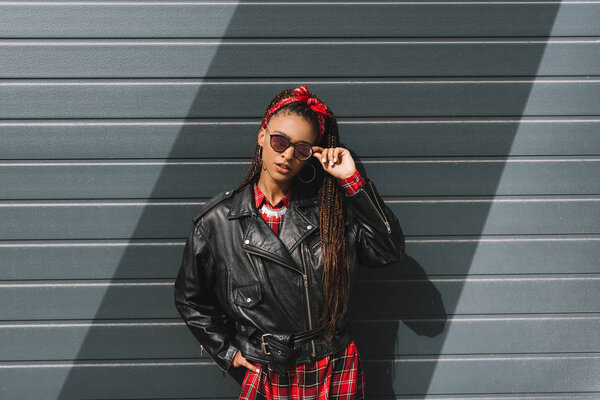 girl in leather jacket and sunglasses