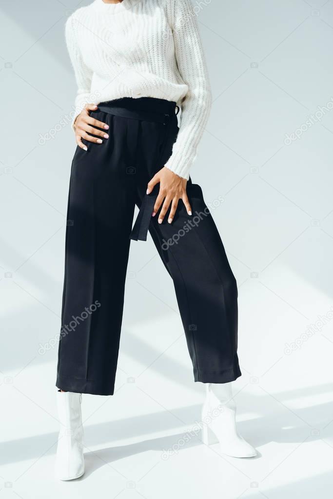 girl in trendy black pants