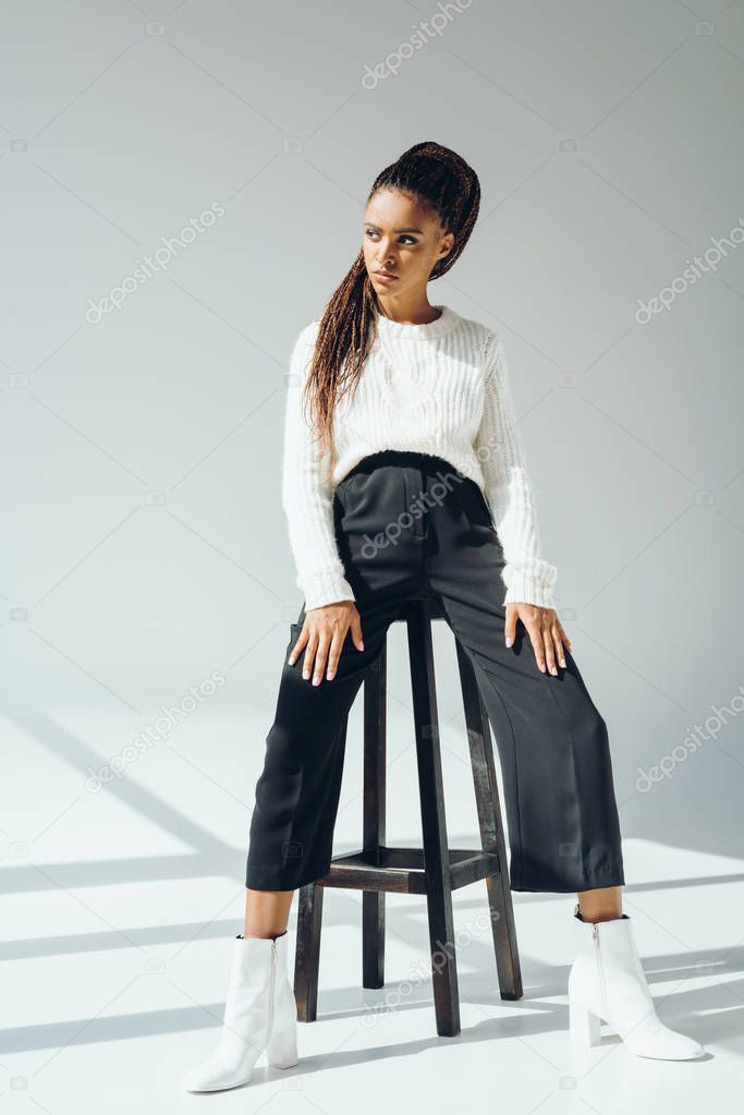 african american model posing with stool
