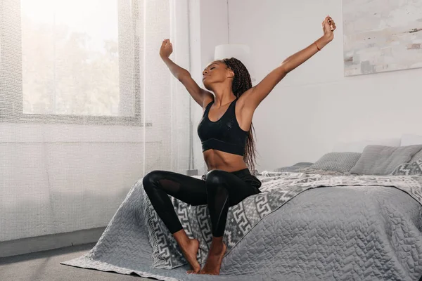 Woman in sportswear stretching — Stock Photo, Image