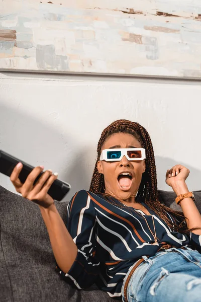 Woman watching tv in 3d goggles — Stock Photo, Image