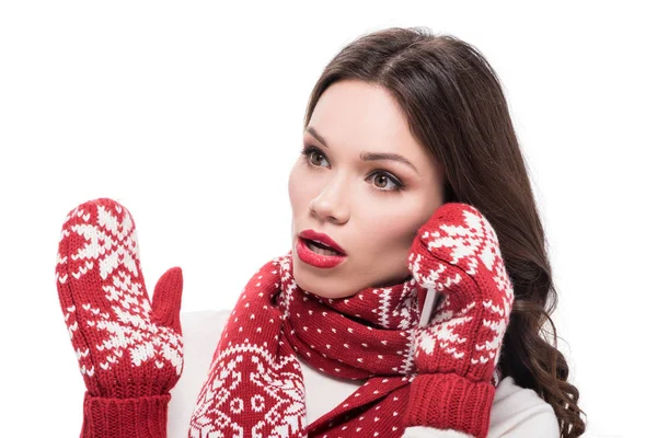 Woman in scarf and mittens talking on phone — Free Stock Photo