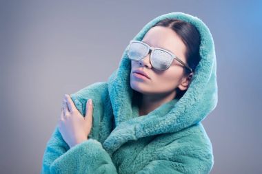 woman with frost on face wearing robe clipart