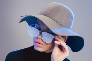 woman in trendy hat and sunglasses clipart