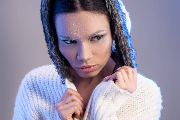 woman with frost on face in sweater