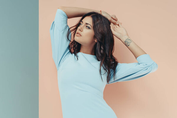 Woman in fashionable turquoise dress