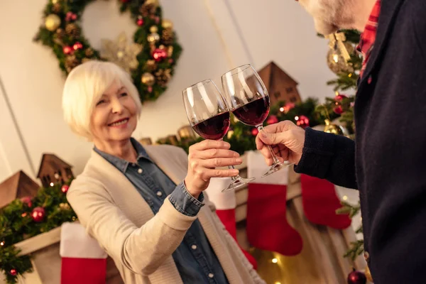 Senior with wine at christmas eve — Stock Photo, Image