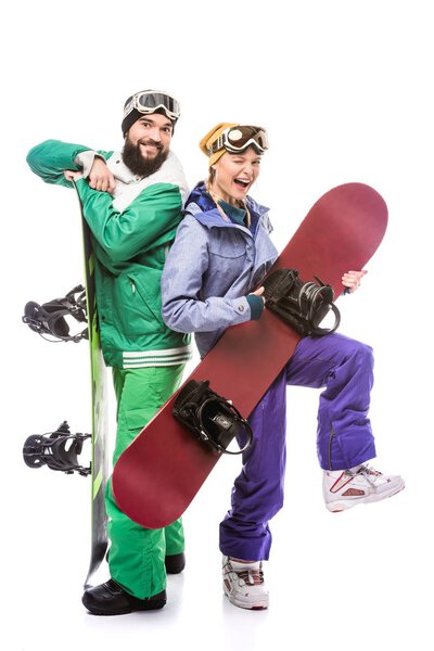 couple in snowboarding costumes with snowboards