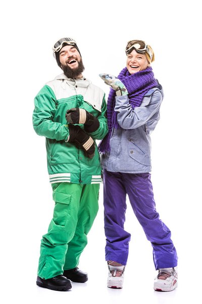 happy couple in snowboarding costumes