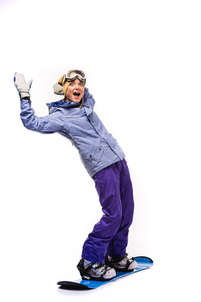 woman standing on snowboard