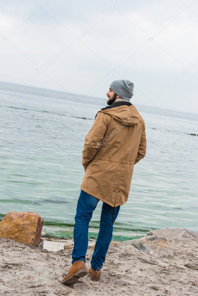 lonely man looking at sea