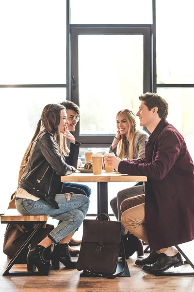 Friends sitting at cafe — Stock Photo, Image