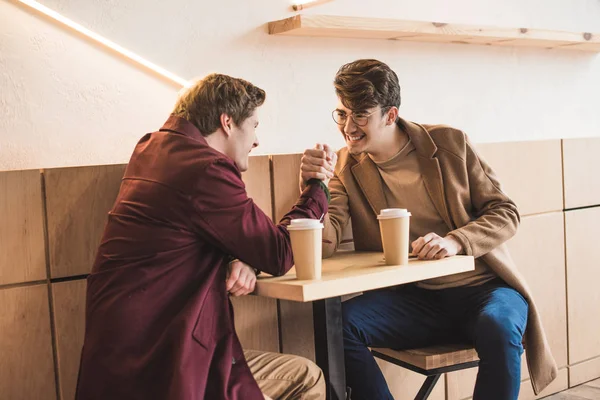 Young men arm wrestling — Stock Photo, Image