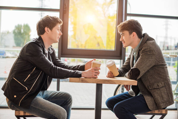 men sitting in cafe